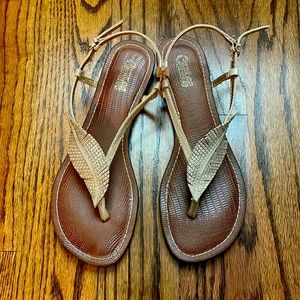 Sandals with gold feather design